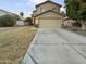 Two-story house with attached garage and front yard at 13033 W Avalon Dr, Avondale, AZ 85392