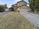 Two-story house with attached garage and front yard at 13033 W Avalon Dr, Avondale, AZ 85392