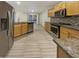 Open kitchen with stainless steel appliances and granite counters at 13033 W Avalon Dr, Avondale, AZ 85392