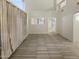 Bright living room featuring high ceilings and tile floors at 13033 W Avalon Dr, Avondale, AZ 85392