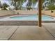 Inviting kidney shaped pool in a fenced backyard at 13033 W Avalon Dr, Avondale, AZ 85392