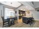 Modern kitchen features island with seating, stainless steel appliances, and hardwood floors at 13600 N Fountain Hills Blvd # 604, Fountain Hills, AZ 85268