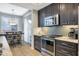 Modern kitchen features dark cabinetry, stainless steel appliances, and granite countertops at 13600 N Fountain Hills Blvd # 604, Fountain Hills, AZ 85268