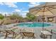 Relaxing pool area with lounge chairs and umbrellas at 13600 N Fountain Hills Blvd # 604, Fountain Hills, AZ 85268