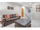 Relaxing sitting area with sofa and ottoman near stairway at 13600 N Fountain Hills Blvd # 604, Fountain Hills, AZ 85268
