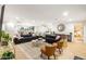 Open concept living room with stylish seating and access to kitchen at 1720 W Sunnyslope Ln, Phoenix, AZ 85021