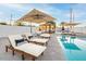 Inviting backyard oasis featuring a refreshing pool, lounge chairs, and a pergola at 1720 W Sunnyslope Ln, Phoenix, AZ 85021