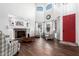 Living room with fireplace, high ceilings, and red door at 18609 W Onyx Ave, Waddell, AZ 85355