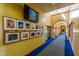 Elegant community hallway with art display and carpet at 20571 N Lemon Drop Dr, Maricopa, AZ 85138