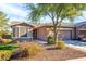 House exterior showcasing landscaping and two-car garage at 20571 N Lemon Drop Dr, Maricopa, AZ 85138