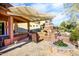 Outdoor patio area with fireplace and seating at 20571 N Lemon Drop Dr, Maricopa, AZ 85138