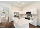 Modern kitchen with white cabinets, quartz countertops, and stainless steel appliances at 23113 N 89Th Pl, Scottsdale, AZ 85255