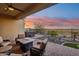 Covered patio with fire pit and hot tub, offering scenic views at 2317 N Beverly Pl, Buckeye, AZ 85396