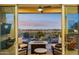Relaxing patio with fire pit and seating area, overlooking backyard at 2317 N Beverly Pl, Buckeye, AZ 85396