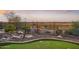 Landscaped backyard with putting green and desert landscape at 2317 N Beverly Pl, Buckeye, AZ 85396