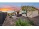 Hot tub and backyard with desert landscaping at 2317 N Beverly Pl, Buckeye, AZ 85396