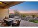 Spacious backyard patio with hot tub and seating area at 2317 N Beverly Pl, Buckeye, AZ 85396
