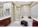 Spa-like bathroom with double sinks, shower, and soaking tub at 2317 N Beverly Pl, Buckeye, AZ 85396