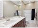 Modern bathroom with double sinks and a shower/tub combo at 2317 N Beverly Pl, Buckeye, AZ 85396