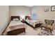 Charming bedroom with twin beds and a sitting area at 2317 N Beverly Pl, Buckeye, AZ 85396