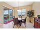 Casual dining area with sliding door access to the backyard patio at 2317 N Beverly Pl, Buckeye, AZ 85396