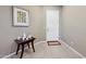 Bright entryway with tile flooring, a decorative table, and an interior door at 2317 N Beverly Pl, Buckeye, AZ 85396