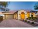 Beautiful home exterior with a two-car garage and landscaped yard at 2317 N Beverly Pl, Buckeye, AZ 85396