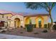 Stunning curb appeal with arched entryway and landscaping at 2317 N Beverly Pl, Buckeye, AZ 85396