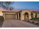 Beautiful home exterior with brick driveway and landscaping at 2317 N Beverly Pl, Buckeye, AZ 85396