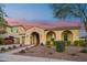 Stunning curb appeal with arched entryway and landscaping at 2317 N Beverly Pl, Buckeye, AZ 85396