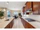 Modern kitchen with stainless steel appliances, gas cooktop and breakfast nook at 2317 N Beverly Pl, Buckeye, AZ 85396