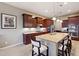 Island kitchen with stainless steel appliances and granite countertops at 2317 N Beverly Pl, Buckeye, AZ 85396
