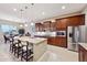 Open concept kitchen featuring stainless steel appliances and an island at 2317 N Beverly Pl, Buckeye, AZ 85396