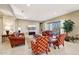 Spacious living room with leather furniture and large TV at 2317 N Beverly Pl, Buckeye, AZ 85396