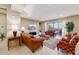 Spacious living room with leather furniture and large TV at 2317 N Beverly Pl, Buckeye, AZ 85396