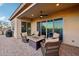 Covered patio with seating area and fire pit at 2317 N Beverly Pl, Buckeye, AZ 85396