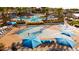 Community pool with a splash pad and lounge area at 2317 N Beverly Pl, Buckeye, AZ 85396