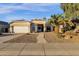 Single-story home with a two-car garage and landscaped front yard at 240 W Brooks St, Gilbert, AZ 85233