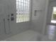 Bathroom with walk in shower, glass block window and marble at 26811 N 41St Ct, Cave Creek, AZ 85331