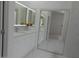 Elegant bathroom featuring double vanity and a mirrored closet at 26811 N 41St Ct, Cave Creek, AZ 85331