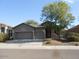 Single-story home with a two-car garage and landscaped front yard at 26811 N 41St Ct, Cave Creek, AZ 85331