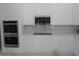Modern kitchen with white cabinets and quartz countertops at 26811 N 41St Ct, Cave Creek, AZ 85331