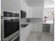 Modern kitchen features stainless steel appliances and white cabinetry at 26811 N 41St Ct, Cave Creek, AZ 85331