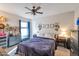 Spacious bedroom with a queen bed, large window, and ceiling fan at 307 E Impala Ct, Casa Grande, AZ 85122