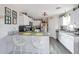 Kitchen island with seating, white cabinets and granite countertops at 307 E Impala Ct, Casa Grande, AZ 85122