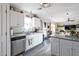 White shaker cabinets, granite countertops, and stainless steel appliances at 307 E Impala Ct, Casa Grande, AZ 85122