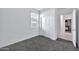 Simple bedroom with grey carpet and double door closet at 35816 W San Ildefanso Ave, Maricopa, AZ 85138