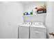 Bright laundry room with washer and dryer included at 35816 W San Ildefanso Ave, Maricopa, AZ 85138