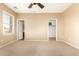 Bright bedroom featuring a large window and ceiling fan at 4095 E Jasper Dr, Gilbert, AZ 85296