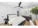 Bedroom with a large bed, dresser, and ceiling fan at 4305 E Osborn Rd, Phoenix, AZ 85018